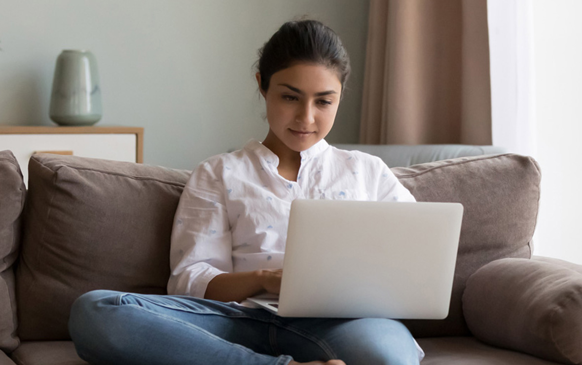 Woman Looking at Real Estate on Her Laptop